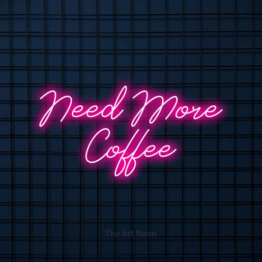 Hot pink script-style LED neon sign reading "Need More Coffee" against a dark blue tiled wall for café décor