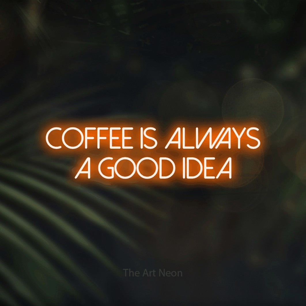 Orange LED neon sign reading "Coffee is Always a Good Idea" against dark blurred palm leaves for café décor