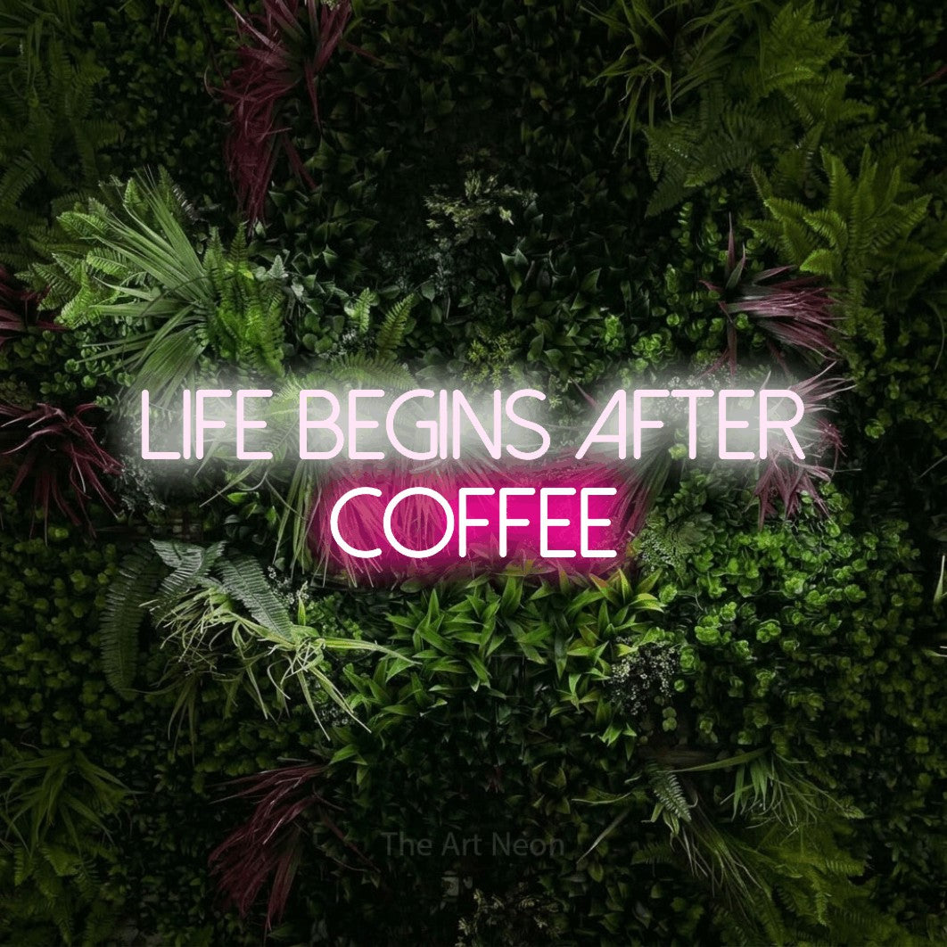Hot pink and cool white LED neon sign reading "Life Begins After Coffee" against a lush garden wall with pink flowers