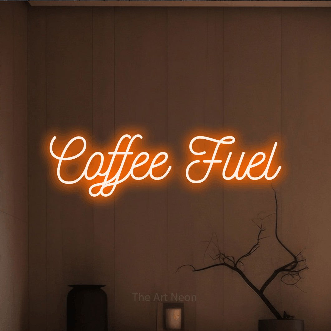 Orange script-style LED neon sign reading "Coffee Fuel" against a warm brown wall for café décor