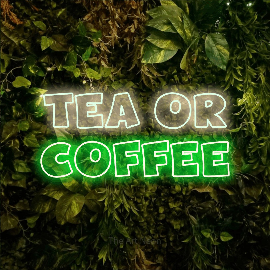 Green and warm white outline-style LED neon sign reading "Tea or Coffee" against a textured moss and foliage wall