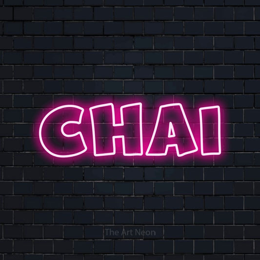Hot pink outline-style LED neon sign reading "Chai" against a dark navy brick wall for café décor