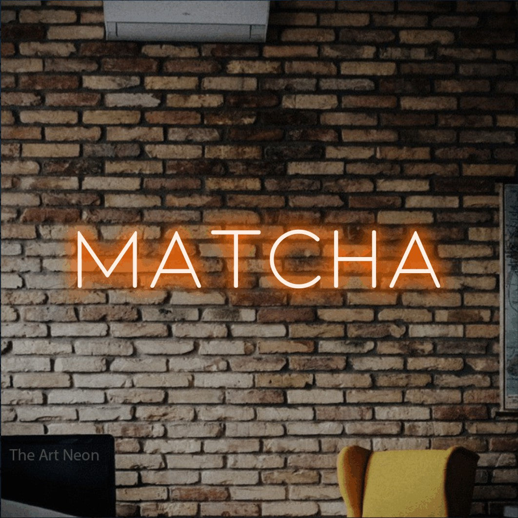 Orange LED neon sign reading "Matcha" against a rustic brick wall for café décor