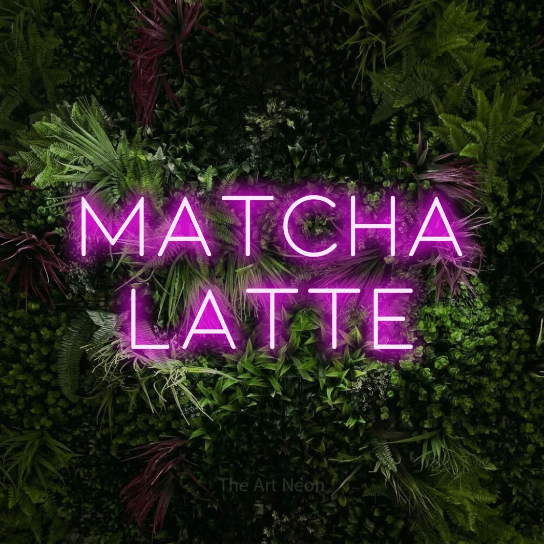Pink LED neon sign reading "Matcha Latte" against a lush garden wall with pink flowers for café décor