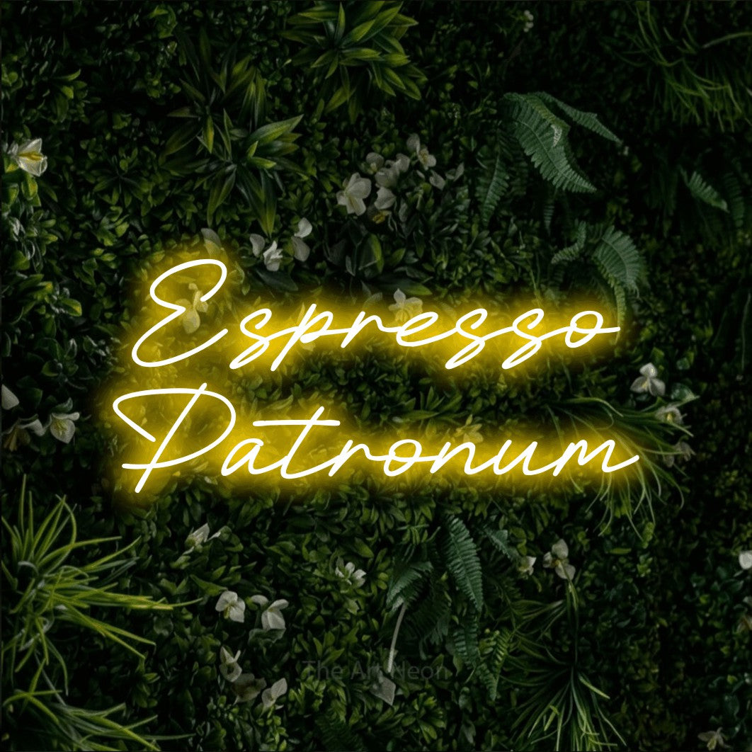 Yellow LED neon sign reading "Espresso Patronum" against a leafy green wall for café décor