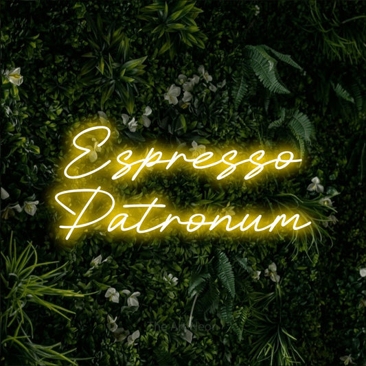 Yellow LED neon sign reading "Espresso Patronum" against a leafy green wall for café décor