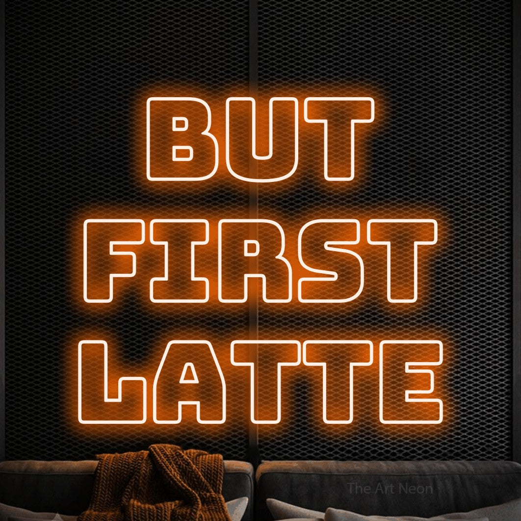 Orange outline-style LED neon sign reading "But First Latte" against a black textured wall for café décor