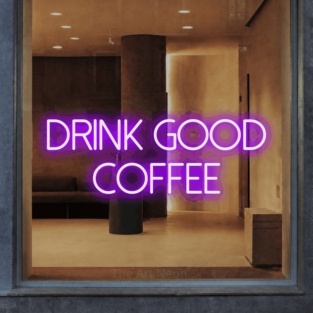 Purple LED neon sign reading "Drink Good Coffee" in a warm modern interior for café décor