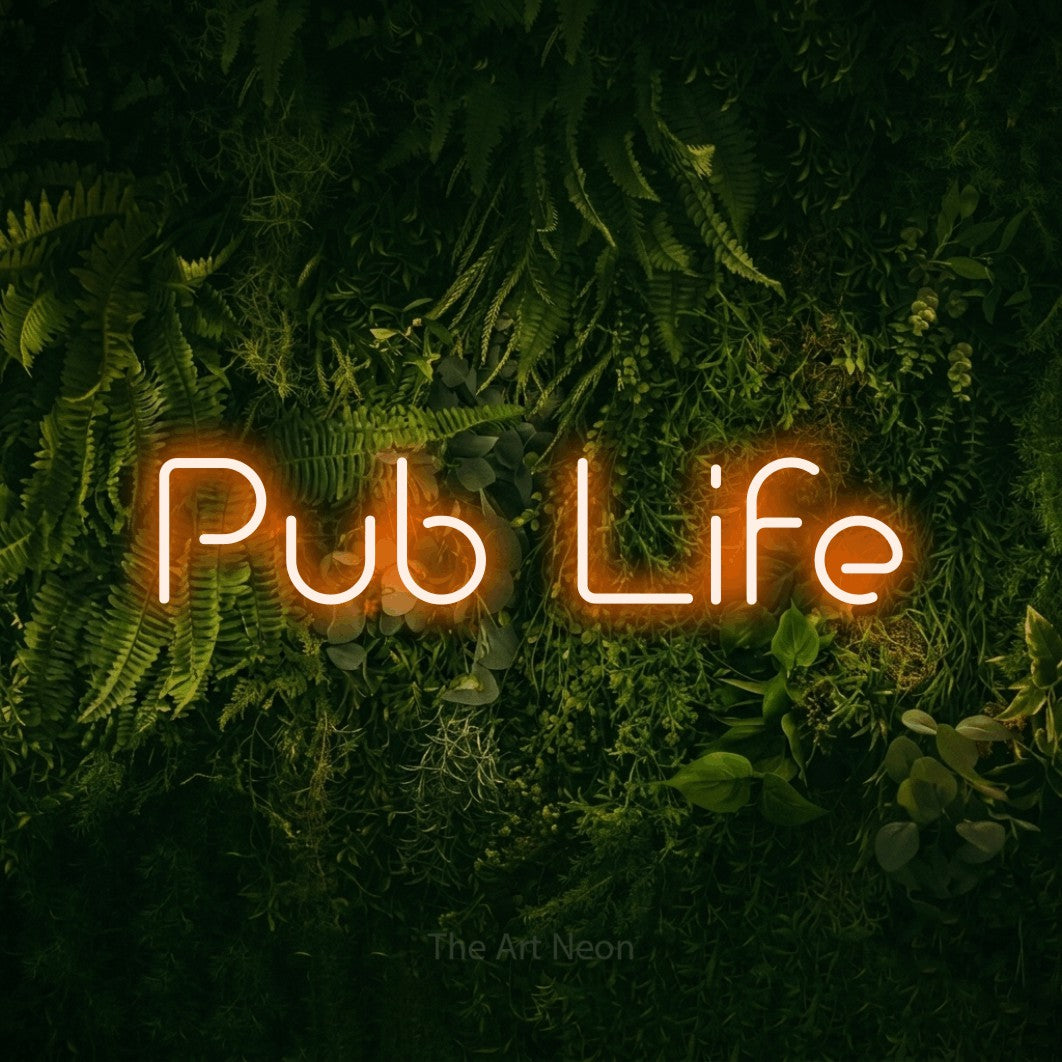 Orange LED neon sign reading "Pub Life" against a moss-covered green wall for bar décor
