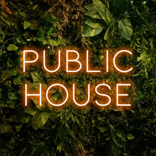 Orange LED neon sign reading "Public House" against a textured moss and foliage wall for bar décor