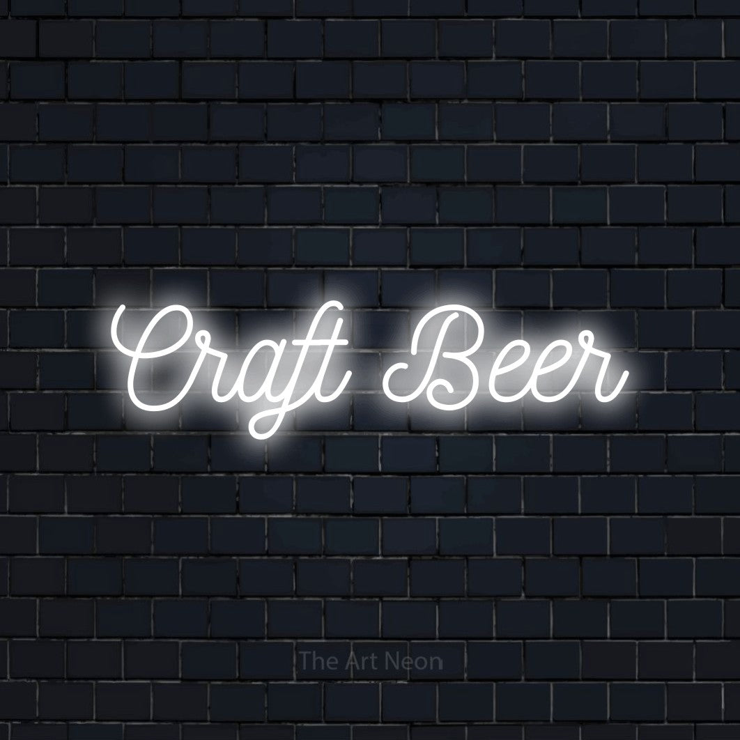 Cool white script-style LED neon sign reading "Craft Beer" against a dark navy brick wall for bar décor