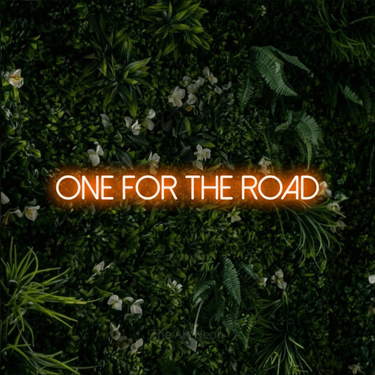 Orange LED neon sign reading "One for the Road" against a leafy green wall for bar décor