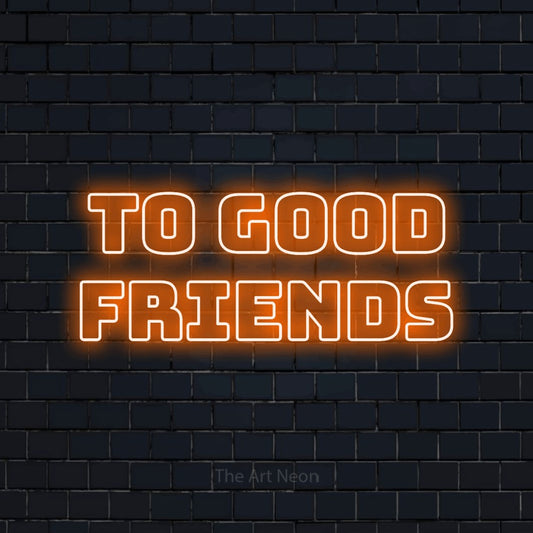 Orange outline-style LED neon sign reading "To Good Friends" against a dark navy brick wall for bar décor
