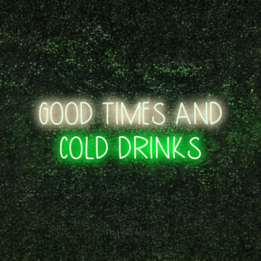 Green and warm white LED neon sign reading "Good Times and Cold Drinks" against a textured green moss wall for bar décor