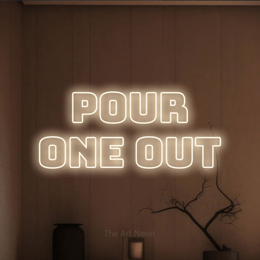 Warm white outline-style LED neon sign reading "Pour One Out" against a warm brown wall for bar décor