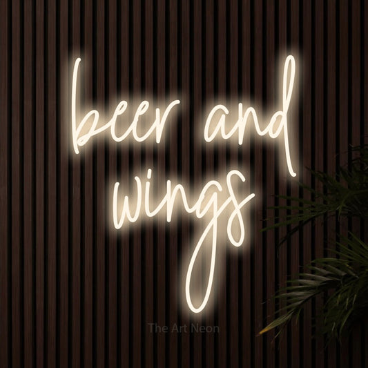 Warm white script-style LED neon sign reading "Beer and Wings" against dark wooden slats for bar décor