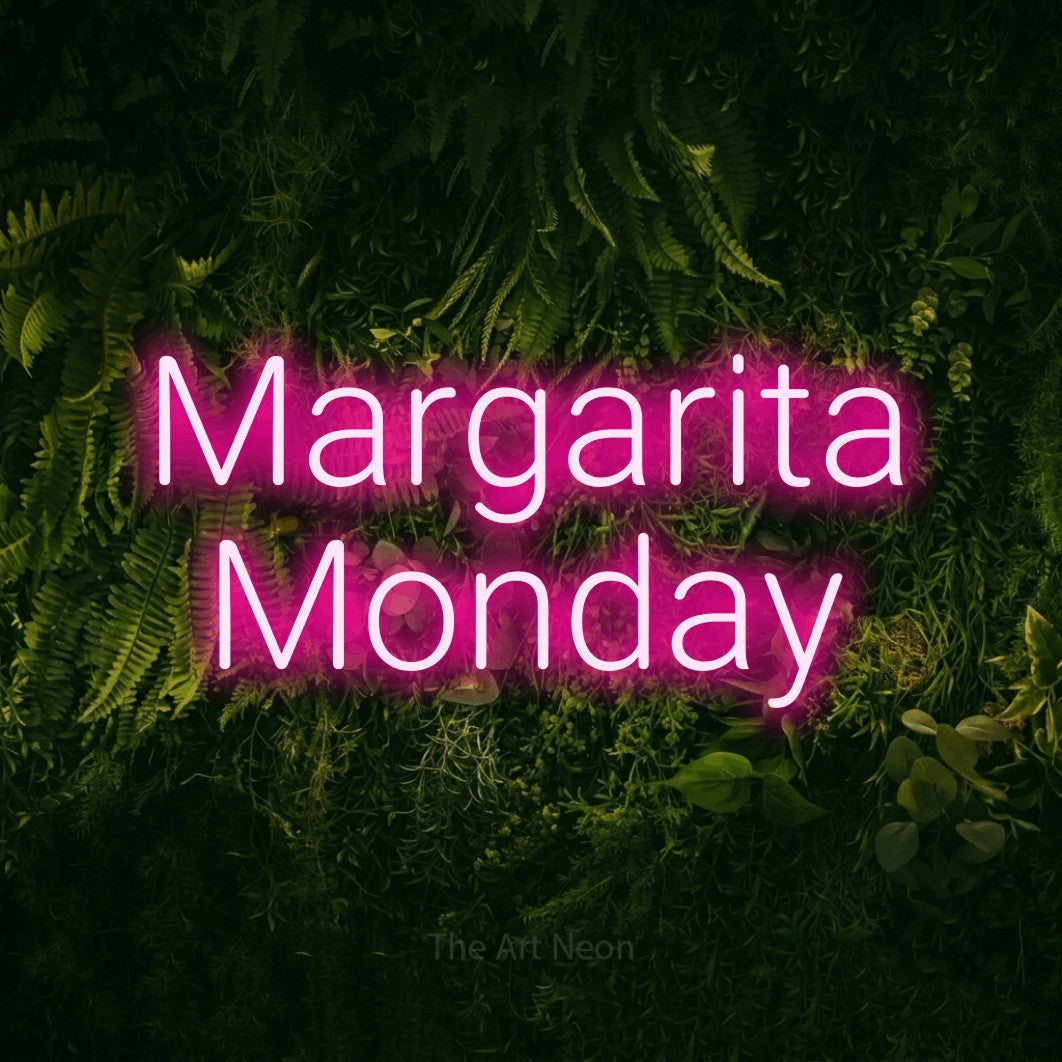 Hot pink LED neon sign reading "Margarita Monday" against a moss-covered green wall for bar décor