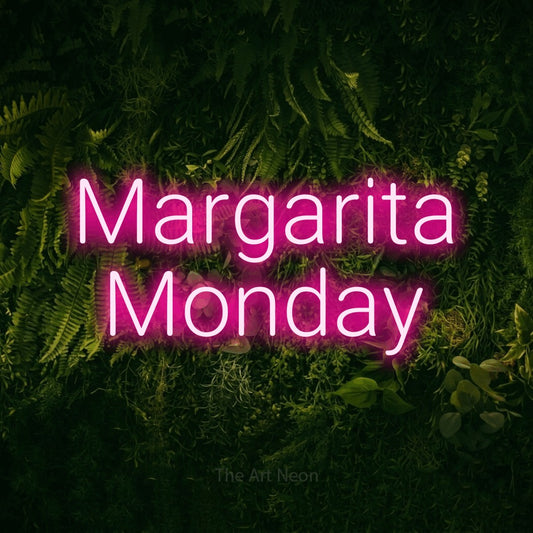 Hot pink LED neon sign reading "Margarita Monday" against a moss-covered green wall for bar décor