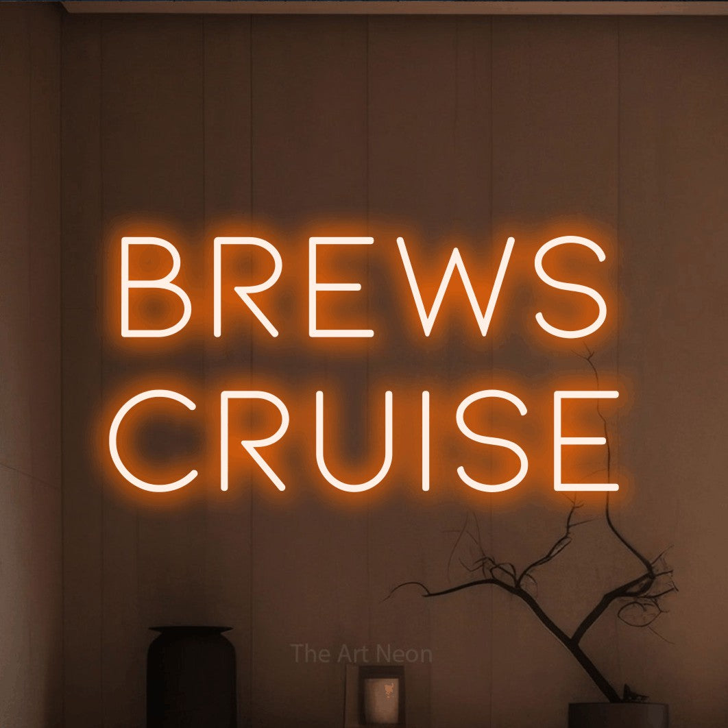 Orange LED neon sign reading "Brews Cruise" against a warm brown wall for bar décor