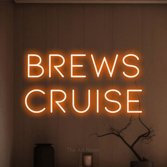 Orange LED neon sign reading "Brews Cruise" against a warm brown wall for bar décor