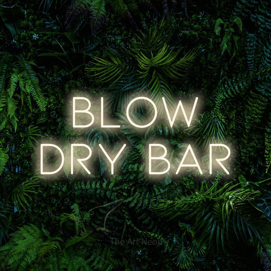 Warm white LED neon sign reading "Blow Dry Bar" against a dense tropical foliage wall for salon décor