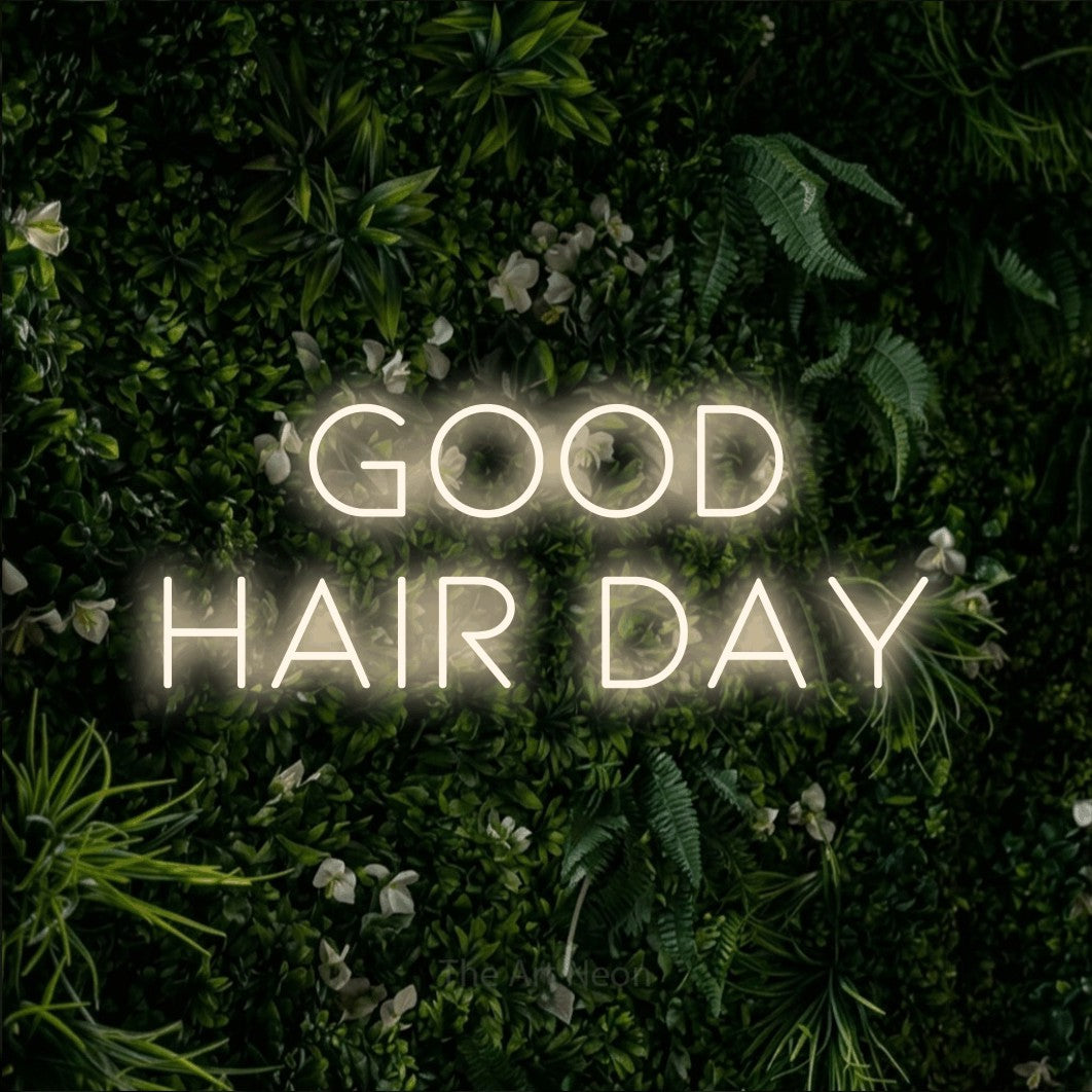 Warm white LED neon sign reading "Good Hair Day" against a leafy green wall for salon décor