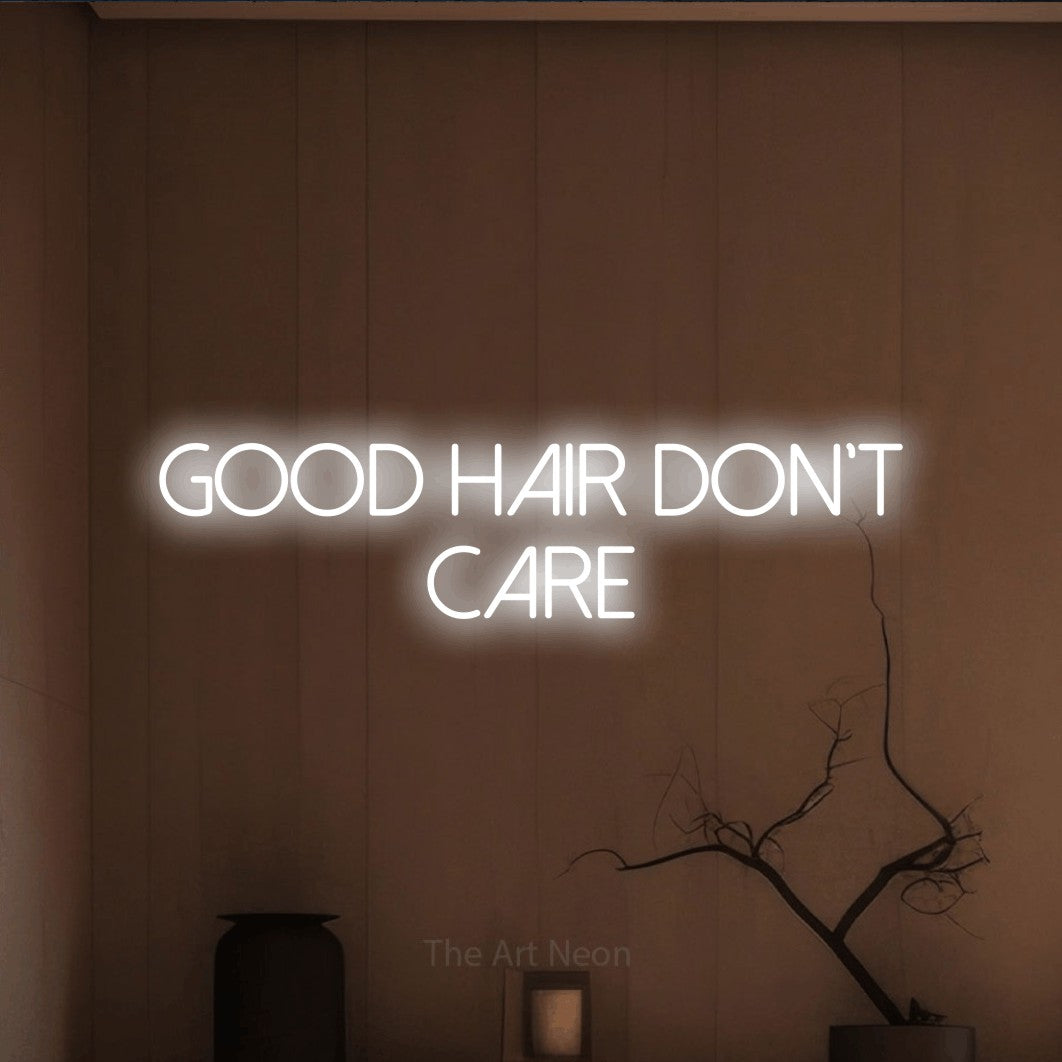 Cool white LED neon sign reading "Good Hair Don't Care" against a warm brown wall for salon décor
