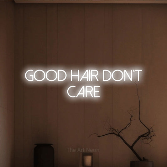 Cool white LED neon sign reading "Good Hair Don't Care" against a warm brown wall for salon décor