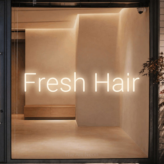 Warm white LED neon sign reading "Fresh Hair" against a warm beige alcove wall for salon décor