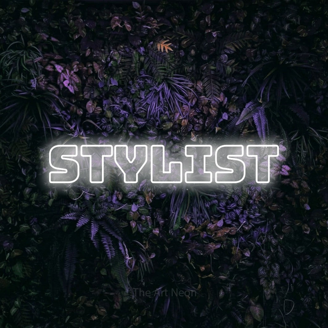 Cool white outline-style LED neon sign reading "Stylist" against a purple floral wall for salon décor