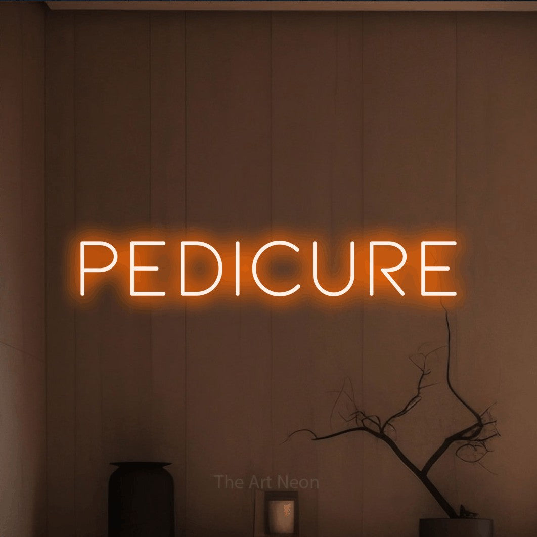Orange LED neon sign reading "Pedicure" against a warm brown wall for salon décor
