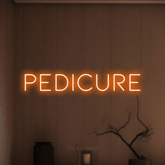 Orange LED neon sign reading "Pedicure" against a warm brown wall for salon décor