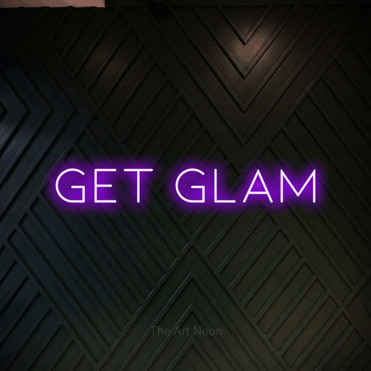 Purple LED neon sign reading "Get Glam" against a dark geometric wood wall for salon décor