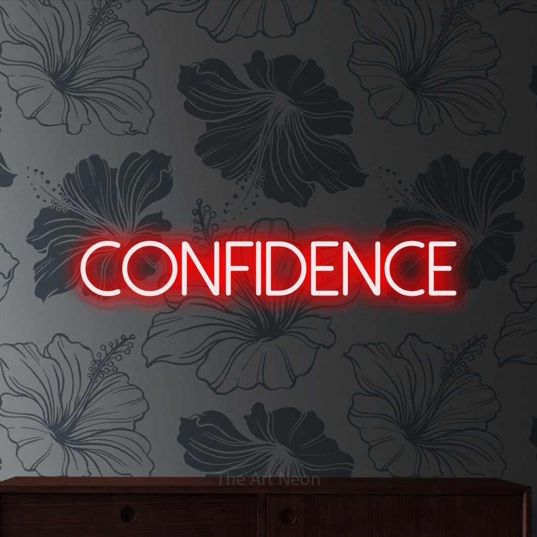 Red LED neon sign reading "Confidence" against grey floral wallpaper for salon décor