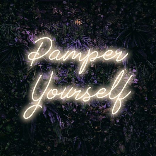 Warm white script-style LED neon sign reading "Pamper Yourself" against a purple floral wall for salon décor