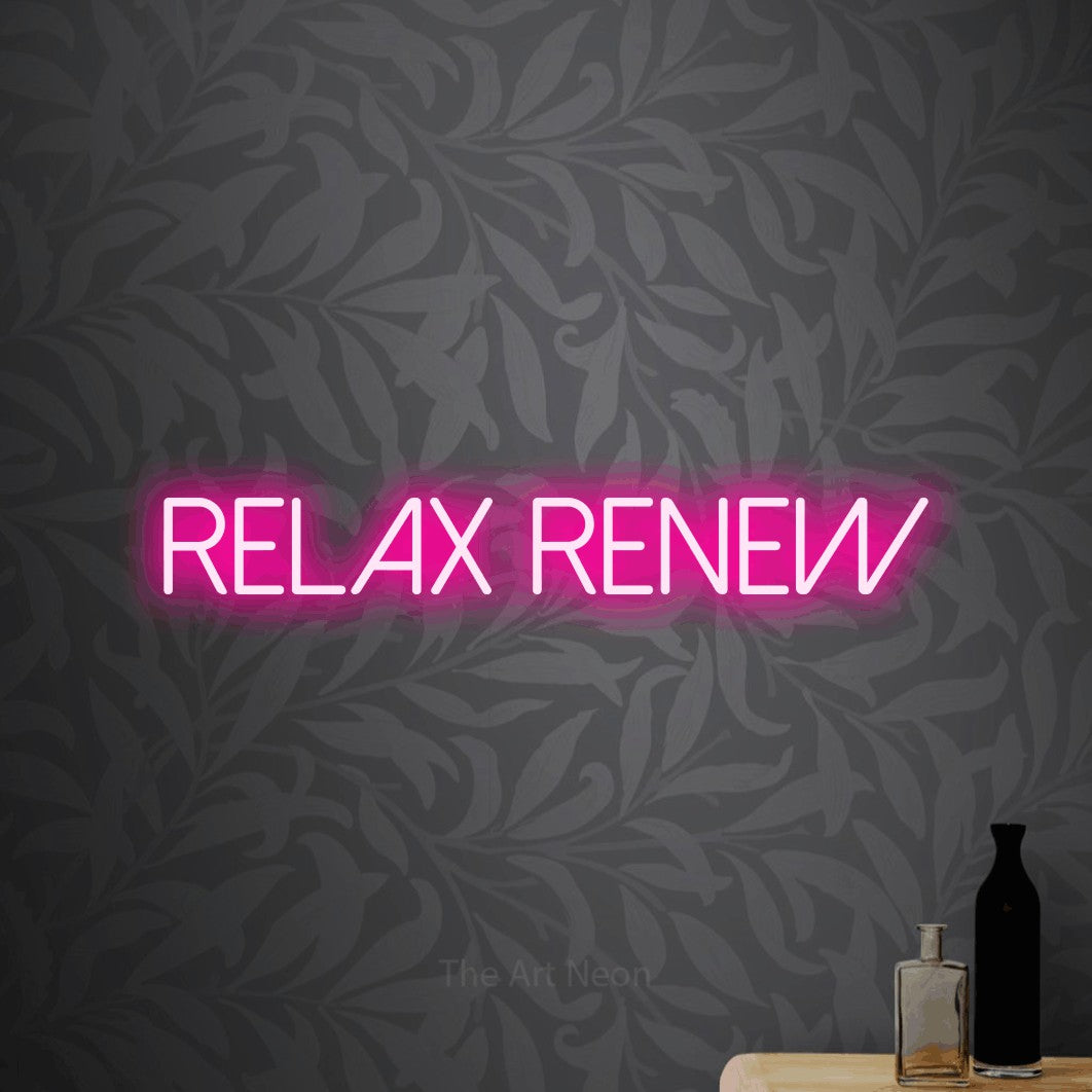 Hot pink LED neon sign reading "Relax Renew" against light grey floral wallpaper for salon décor
