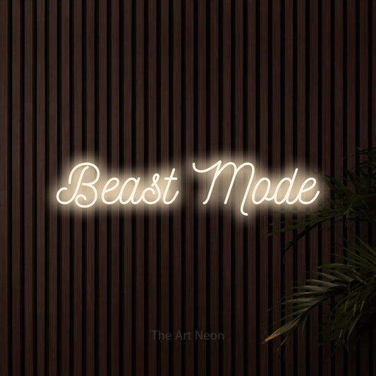 Enseigne néon à DEL à lumière blanche chaude, de style manuscrit, affichant « Beast Mode » sur des lattes de bois foncé, pour décorer une salle d’entraînement