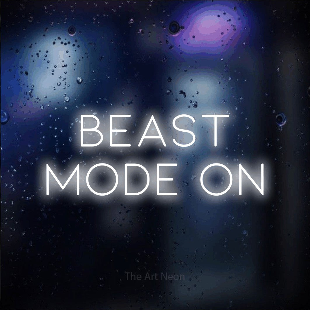 Cool white LED neon sign reading "Beast Mode On" against a dark blue bokeh background for gym décor