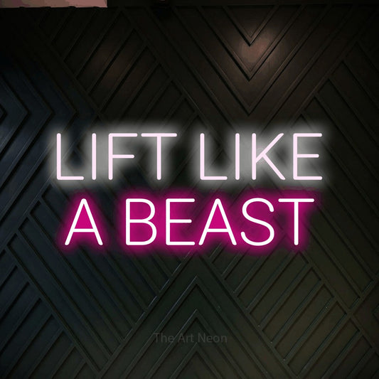 Hot pink and cool white LED neon sign reading "Lift Like a Beast" against a dark geometric wood wall for gym décor