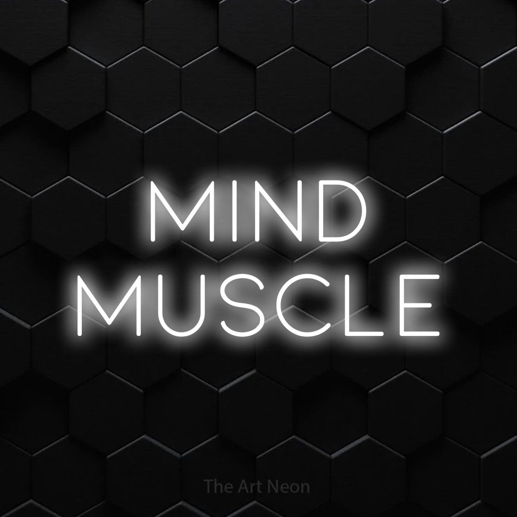 Cool white LED neon sign reading "Mind Muscle" against a black hexagonal wall for gym décor