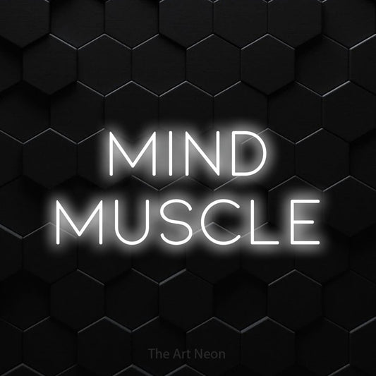 Cool white LED neon sign reading "Mind Muscle" against a black hexagonal wall for gym décor