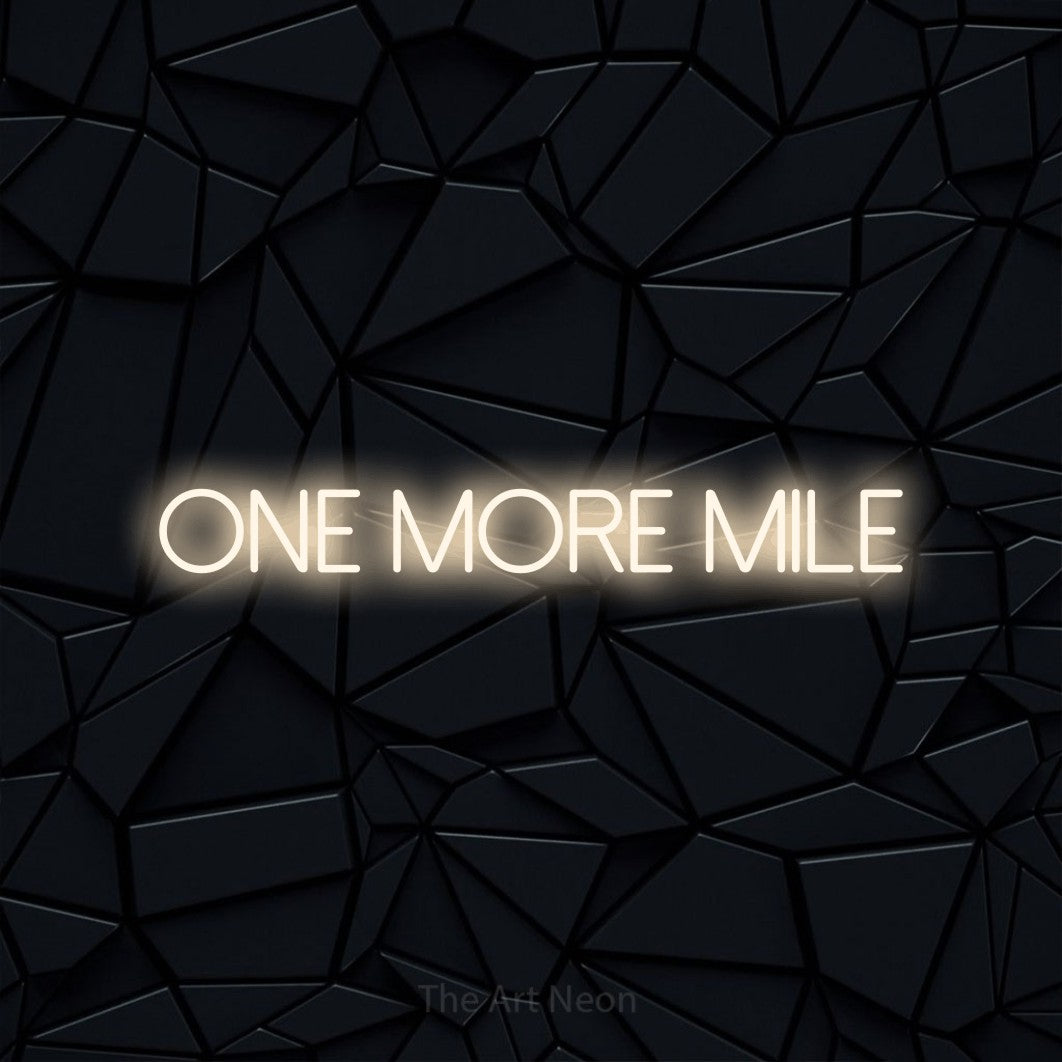Warm white LED neon sign reading "One More Mile" against a black faceted wall for gym décor