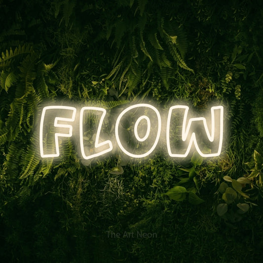 Warm white outline-style LED neon sign reading "Flow" against a moss-covered green wall for gym décor