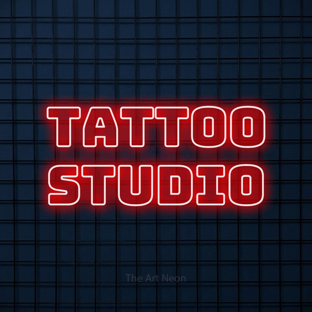 Red outline-style LED neon sign reading "Tattoo Studio" against a dark blue tiled wall for tattoo studio décor