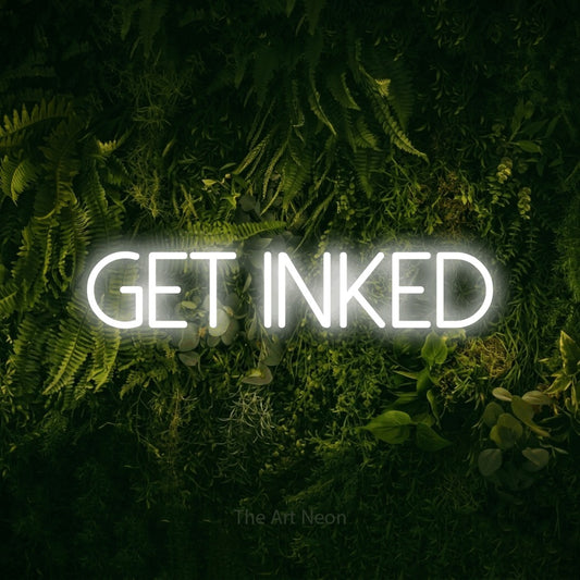Cool white LED neon sign reading "Get Inked" against a moss-covered green wall for tattoo studio décor