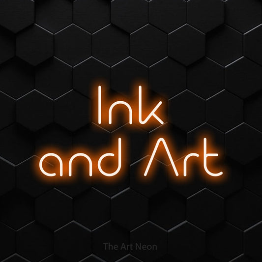 Orange LED neon sign reading "Ink and Art" against a black hexagonal wall for tattoo studio décor