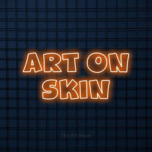 Orange outline-style LED neon sign reading "Art on Skin" against a dark blue tiled wall for tattoo studio décor