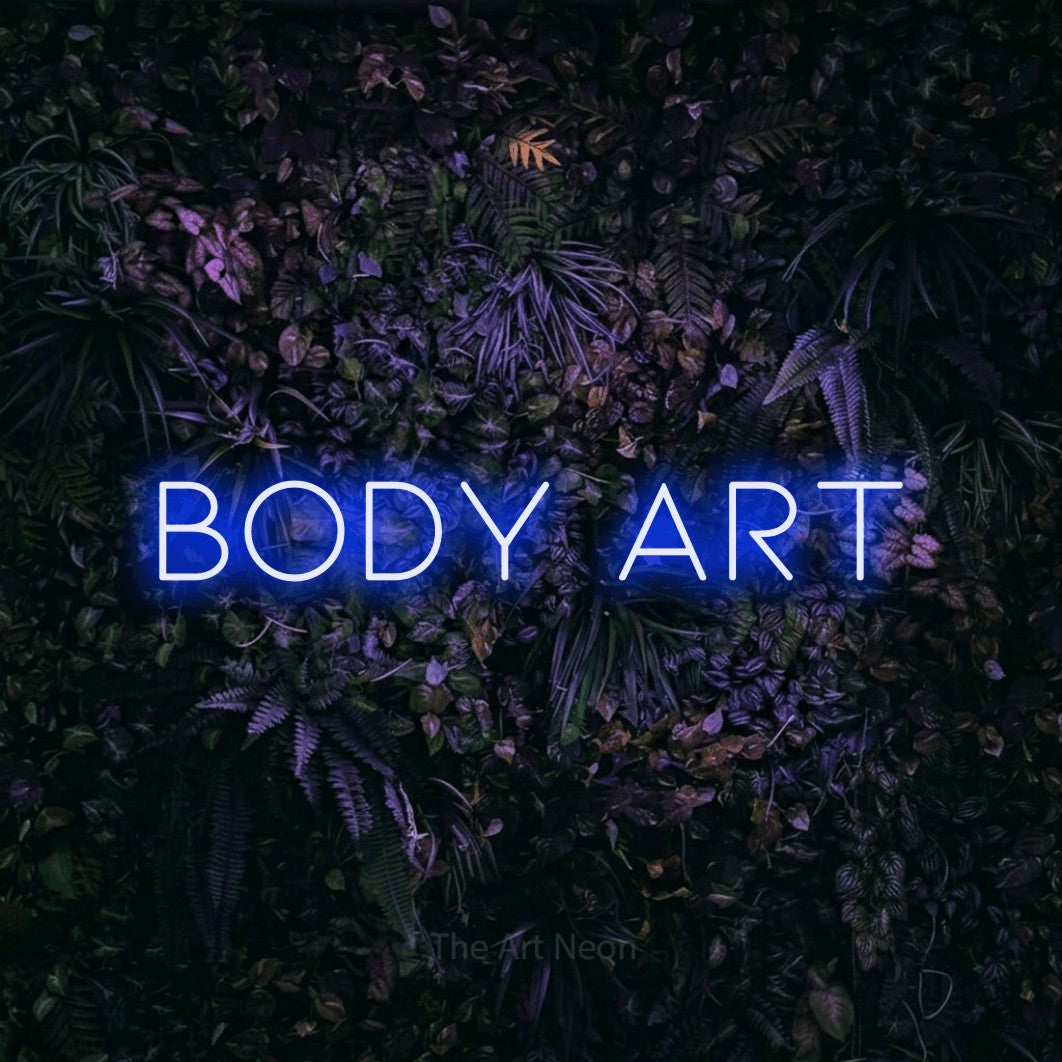 Blue LED neon sign reading "Body Art" against a purple floral wall for tattoo studio décor