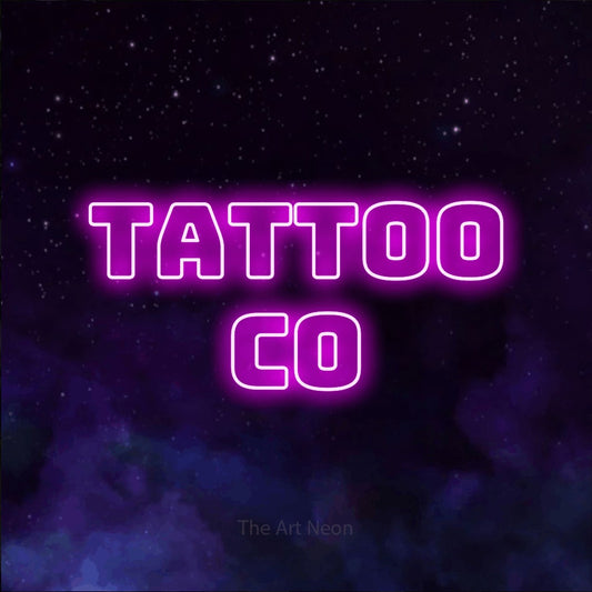 Pink outline-style LED neon sign reading "Tattoo Co" against a purple galaxy background for tattoo studio décor