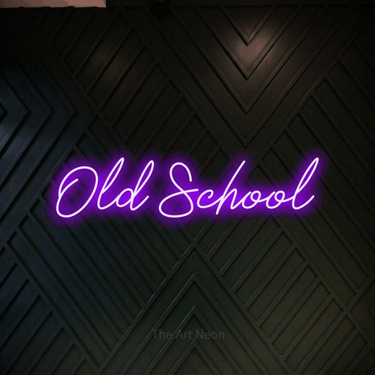 Purple script-style LED neon sign reading "Old School" against a dark geometric wood wall for tattoo studio décor